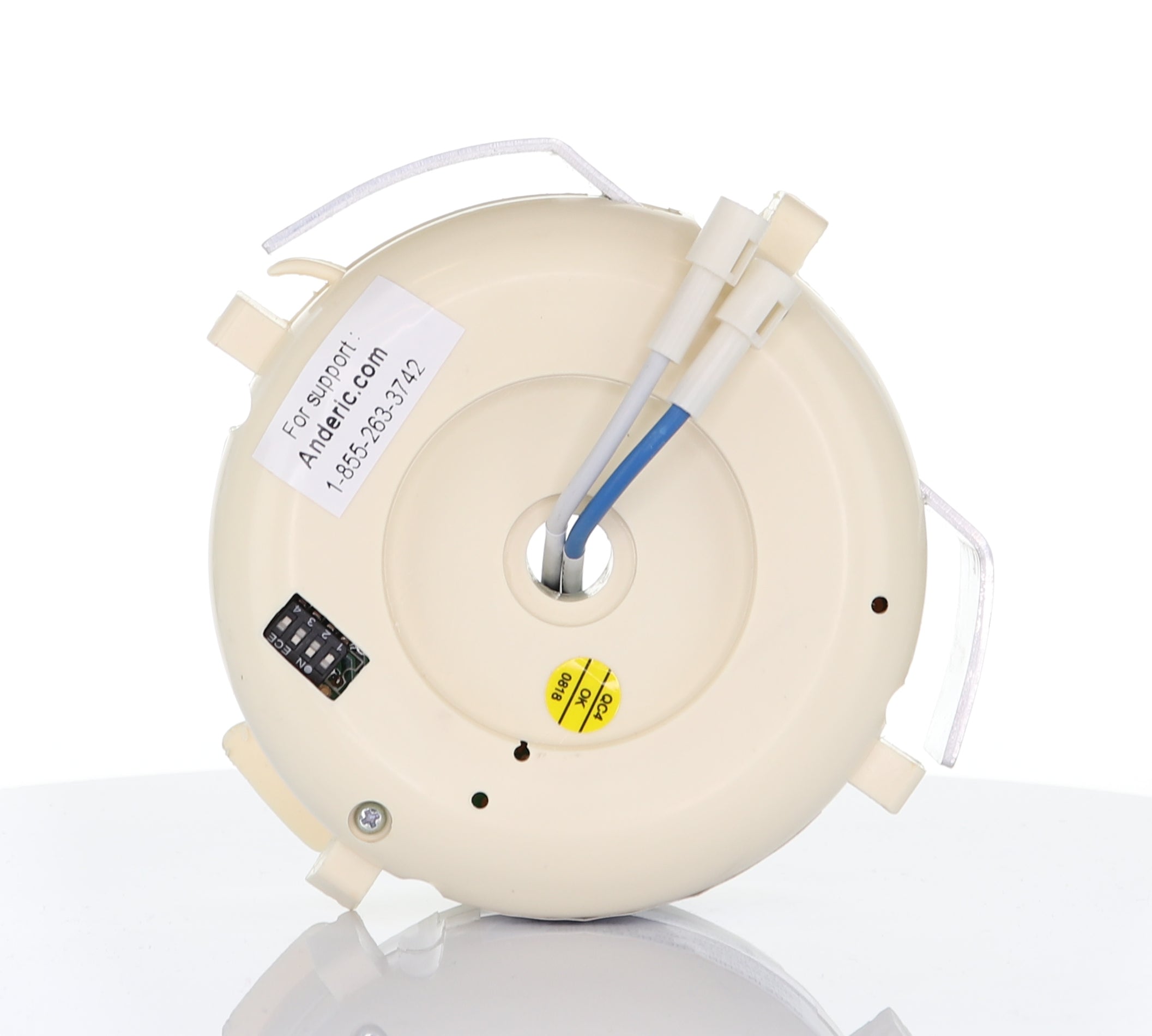 A round, off-white ceiling light fixture with visible wiring and a label marked "Anderic UC7051R Replacement Ceiling Fan Receiver for Hampton Bay" on one side.